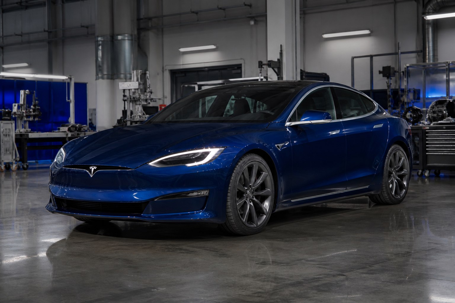 Blue American Tesla Model S in an automotive engineering facility